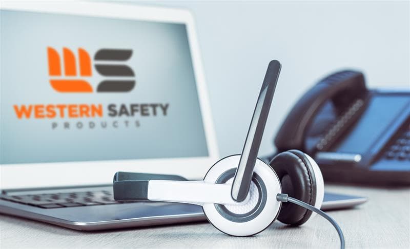 Headphones on a laptop with the Western Safety logo